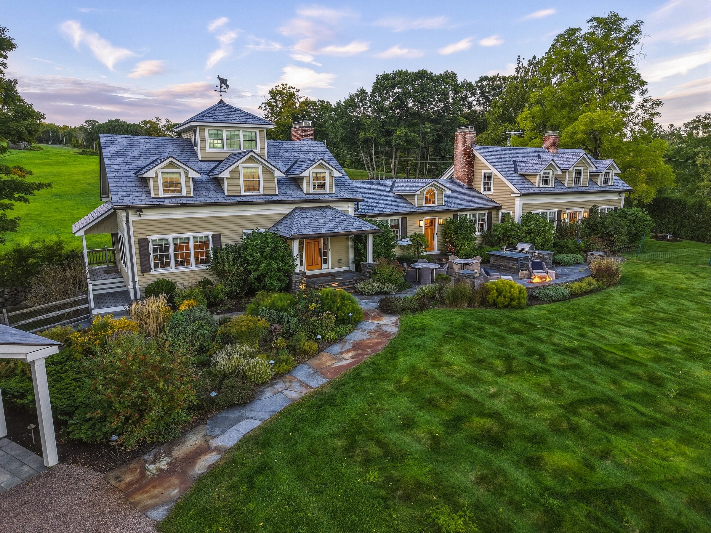 The residence seen from above, with its gardens, stone walkways and lawn