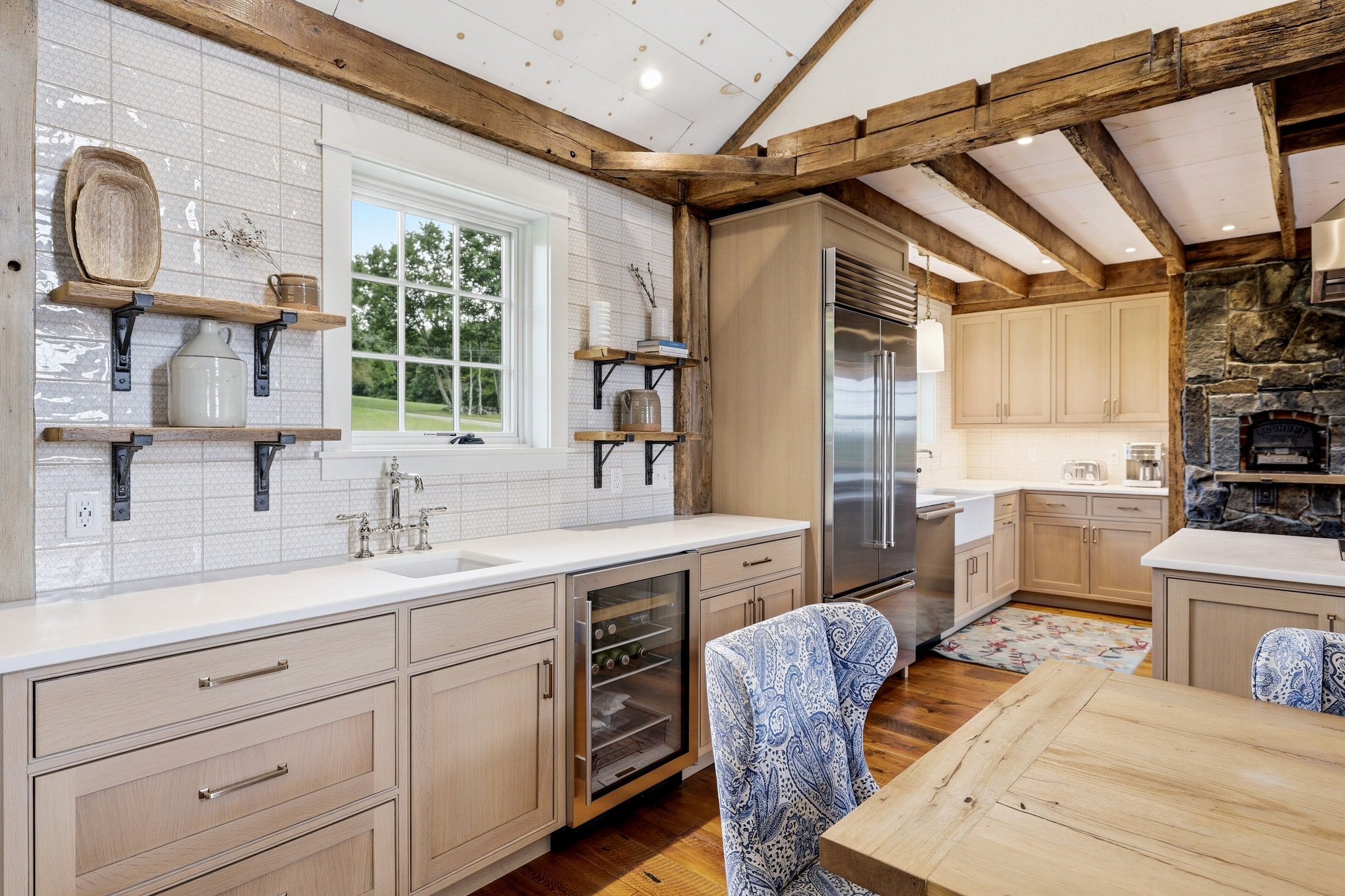 The kitchen, with farmhouse sink, island and upgraded cabinetry