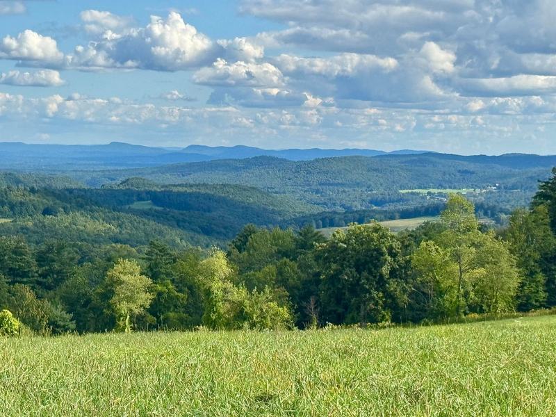 Long southerly view across meadows toward the Mount Holyoke Range