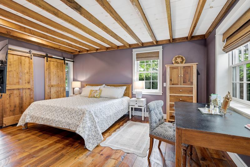 Primary bedroom with sliding barn door